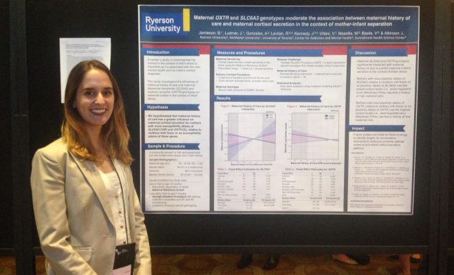 Brittany in front of her research poster