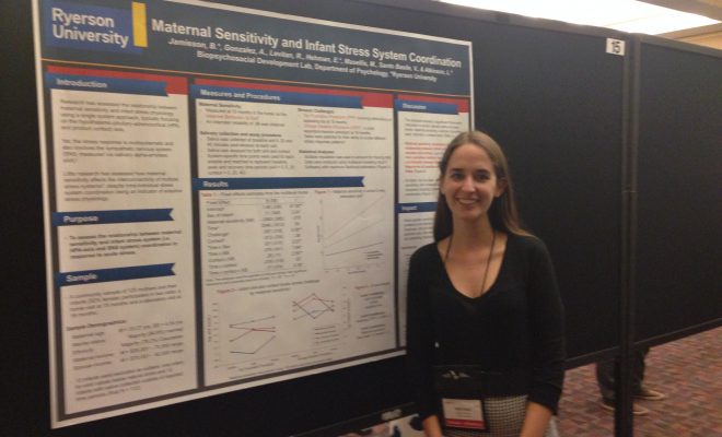 Brittany in front of her poster