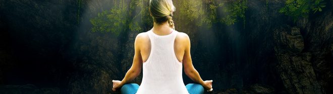 Woman meditating in a cross legged position