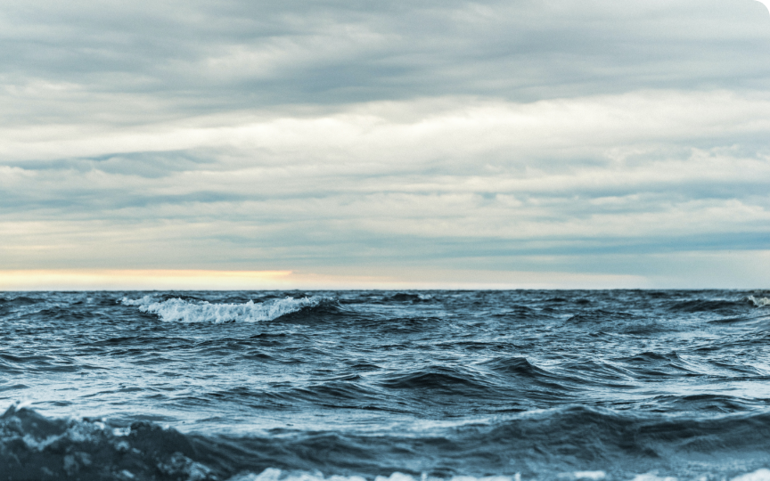 White cap waves and a cloudy sky