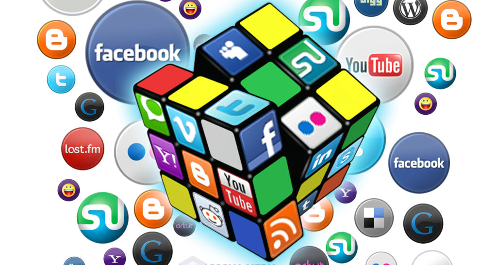 A rubik's cube with images of various social media platform logos; Facebook, YouTube, Reddit, and more.